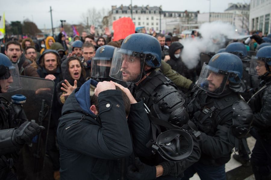 People take part in a demonstration in Nantes on 17 December 2019 to protest against the French government's plan to overhaul the country's retirement system, as part of a national general strike. (Photo by Loic Venance/AFP)