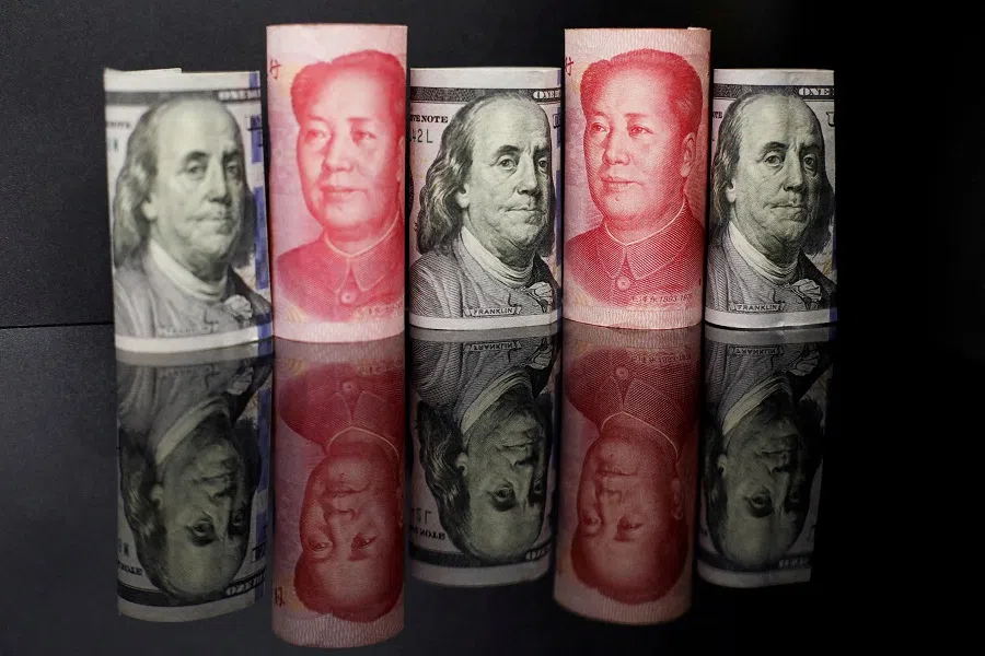 Banknotes of Chinese renminbi and US dollar are seen in this illustration picture taken 29 September 2022. (Florence Lo/Illustration/File Photo/Reuters)