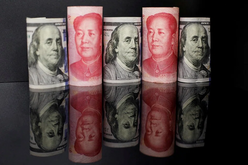 Banknotes of Chinese renminbi and US dollar are seen in this illustration picture taken 29 September 2022. (Florence Lo/Illustration/File Photo/Reuters)