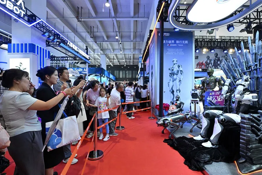 People visit the robot exhibition as part of the 2025 World Robot Conference in Beijing on 8 August 2025. (Adek Berry/AFP)