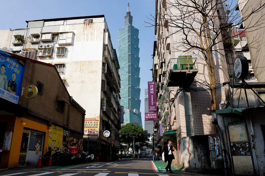 People and cars pass Taipei 101 in Taipei, Taiwan, on 17 April 2025.