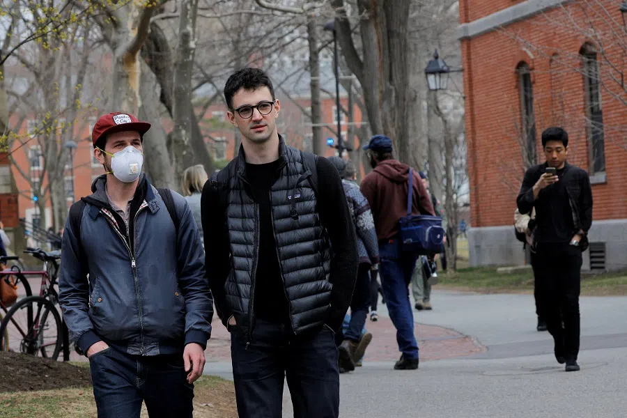 Students walk through the Yard at Harvard University, Cambridge, Massachusetts, US, 10 March 2020. (Brian Snyder/File Photo/Reuters)