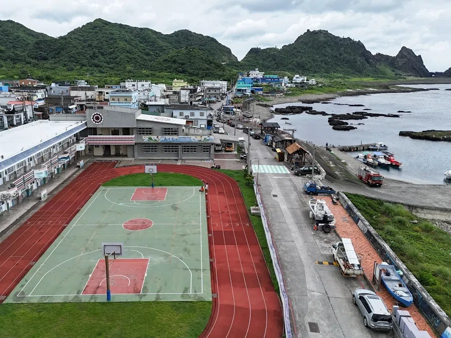 A drone view shows a school and a coastal village on Orchid Island, Taiwan, 14 June 2026.
