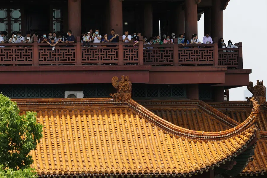 Visitors are seen on the Yellow Crane Tower during the Labour Day holiday in Wuhan, Hubei province, China on 2 May 2021. (Tingshu Wang/Reuters)