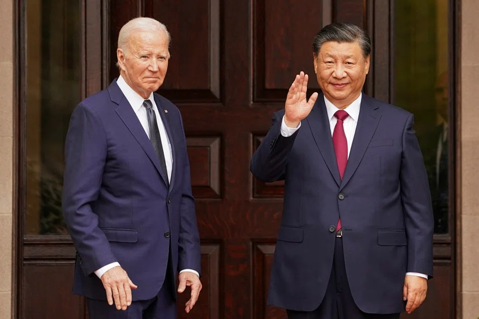 Chinese President Xi Jinping waves as he meets with US President Joe Biden at the Filoli estate on the sidelines of the Asia-Pacific Economic Cooperation (APEC) summit, in Woodside, California, US, on 15 November 2023. (Kevin Lamarque/Reuters)