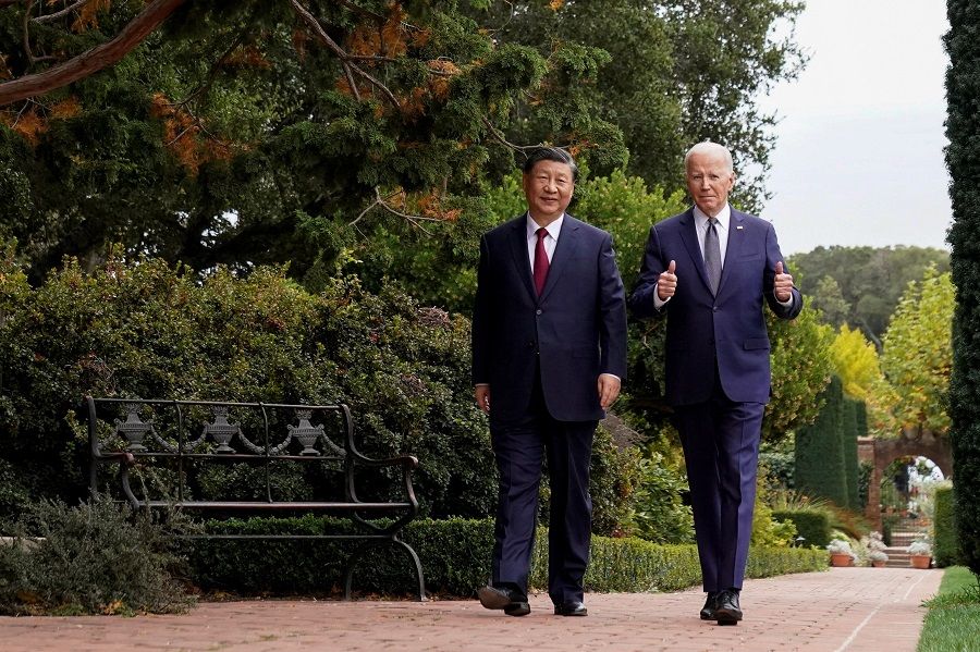 US President Joe Biden gives thumbs-up as he walks with Chinese President Xi Jinping at the Filoli estate on the sidelines of the Asia-Pacific Economic Cooperation (APEC) summit, in Woodside, California, on 15 November 2023. (Kevin Lamarque/Reuters)