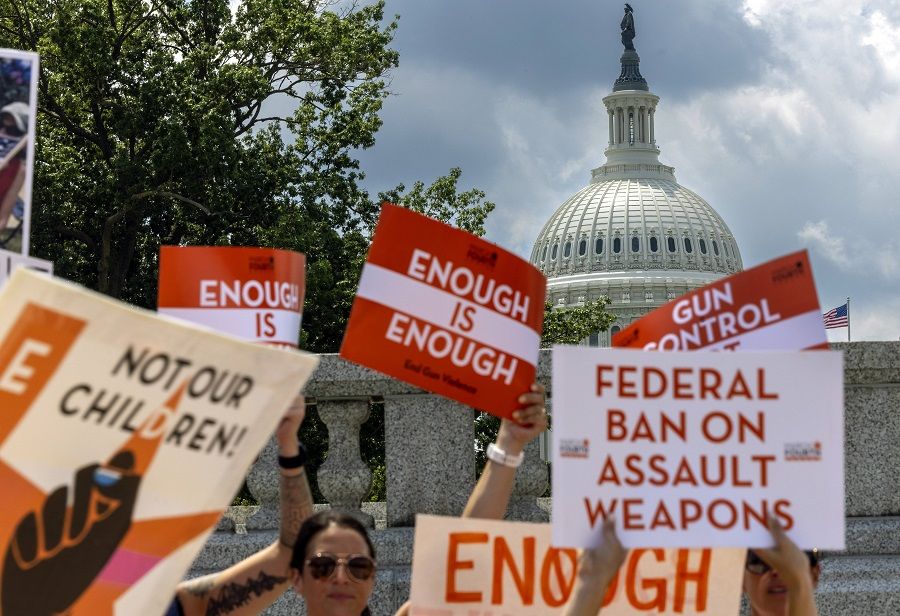 Gun control activists rally near the US Capitol calling for a federal ban on assault weapons on 13 July 2022 in Washington, DC, US. (Kevin Dietsch/Getty Images/AFP)