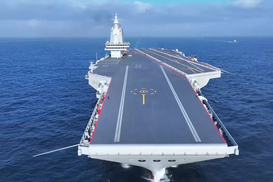 This screen grab from video footage from China’s Ministry of Defence taken in May 2024 and released via AFPTV on 11 May 2024 shows China’s third aircraft carrier Fujian carrying out sea trials at sea in an unknown location. China’s third aircraft carrier entered service after a ceremony this week marking its handover to the navy, state media said on 7 November 2025.