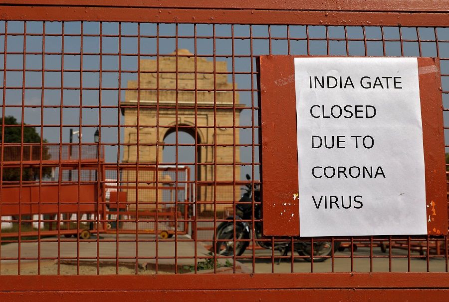 A sign pasted on a security barricade is seen after the India Gate war memorial was closed for visitors amid measures for coronavirus prevention in New Delhi, India, on 19 March 2020. (Adnan Abidi/File Photo/Reuters)