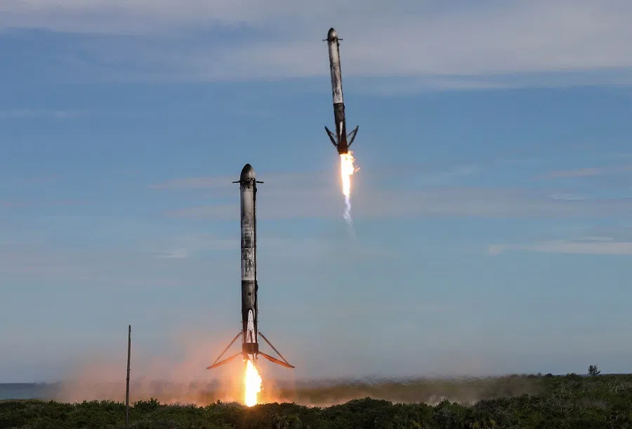 Two boosters return to the Cape Canaveral Space Force Station after launch from the nearby Kennedy Space Center after a SpaceX Falcon Heavy rocket carried the fourth and final satellite of the next-generation series of geostationary weather satellites for NASA and NOAA in Cape Canaveral, Florida, US, on 25 June 2024.  (Joe Skipper/Reuters)