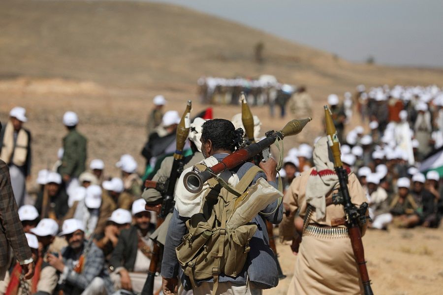 Tribesmen loyal to the Houthis carry RPG launchers during a military parade for new tribal recruits amid escalating tensions with the US-led coalition in the Red Sea, in Bani Hushaish, Yemen, on 22 January 2024. (Khaled Abdullah/Reuters)