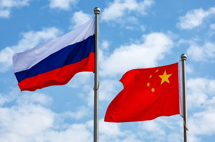 Chinese and Russian flags fly at an airport before a ceremony to welcome Russian President Vladimir Putin, who arrives to attend the Shanghai Cooperation Organisation (SCO) summit in Tianjin, China, 31 August 2025. (Sputnik/Vladimir Smirnov/Pool via Reuters)