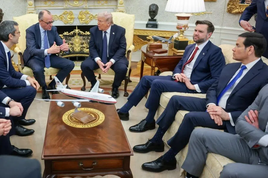 US President Donald Trump and German Chancellor Friedrich Merz sit in the Oval Office, next to US Vice-President JD Vance and Secretary of State Marco Rubio, during a meeting, at the White House in Washington, DC, US, on 3 March 2026. (Jonathan Ernst/Reuters)
