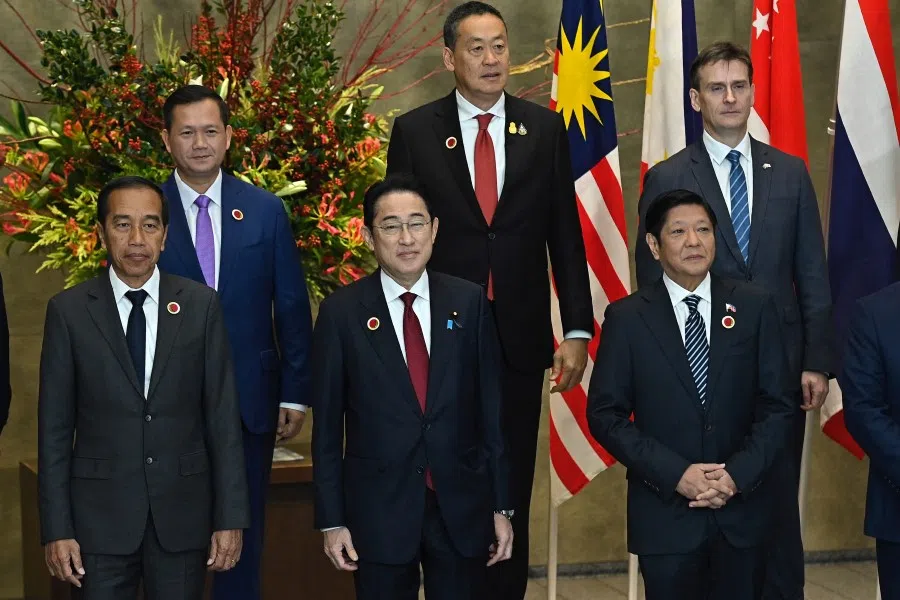 Cambodia's Prime Minister Hun Manet, Thailand's Prime Minister Srettha Thavisin, Australia's ambassador to Japan Justin Hayhurst, Philippines' President Ferdinand Marcos Jr, Indonesian President Joko Widodo and Japanese Prime Minister Fumio Kishida, pose for a group photo prior to the Asian Zero Energy Carbon(AZEC) Summit at the Japan's Prime Minister office in Tokyo on 18 December 2023. AZEC summit is held in Tokyo in conjunction with the ASEAN-JAPAN 50th anniversary Commemorative Summit. (David Mareuil/Reuters)