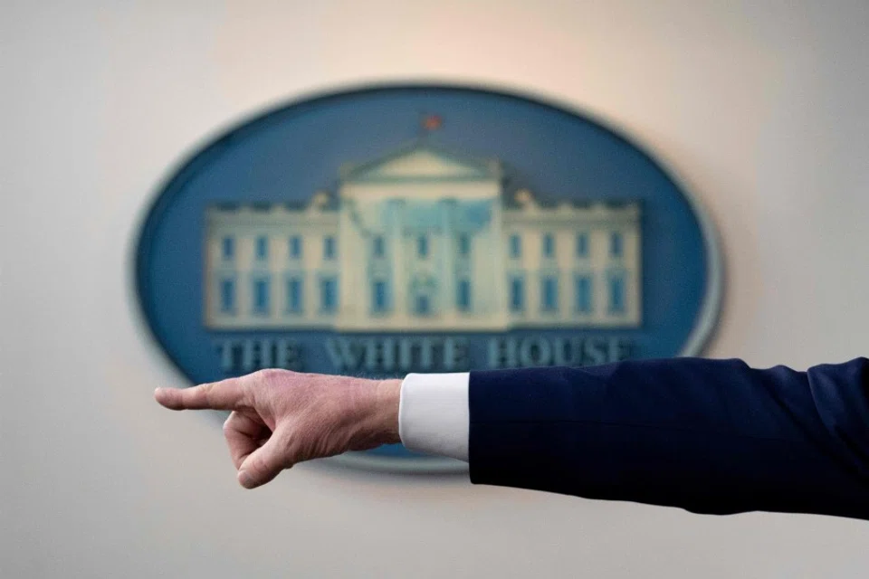 US President Donald Trump's hand is seen as he points to take a question during a Coronavirus Task Force press briefing at the White House in Washington, DC, April 19, 2020. (Jim Watson/AFP)