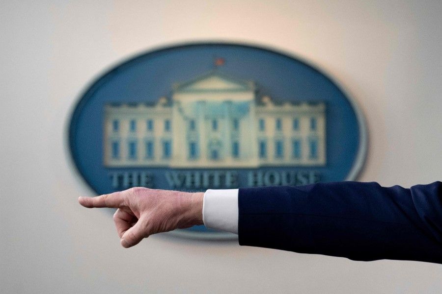 US President Donald Trump's hand is seen as he points to take a question during a Coronavirus Task Force press briefing at the White House in Washington, DC, April 19, 2020. (Jim Watson/AFP)