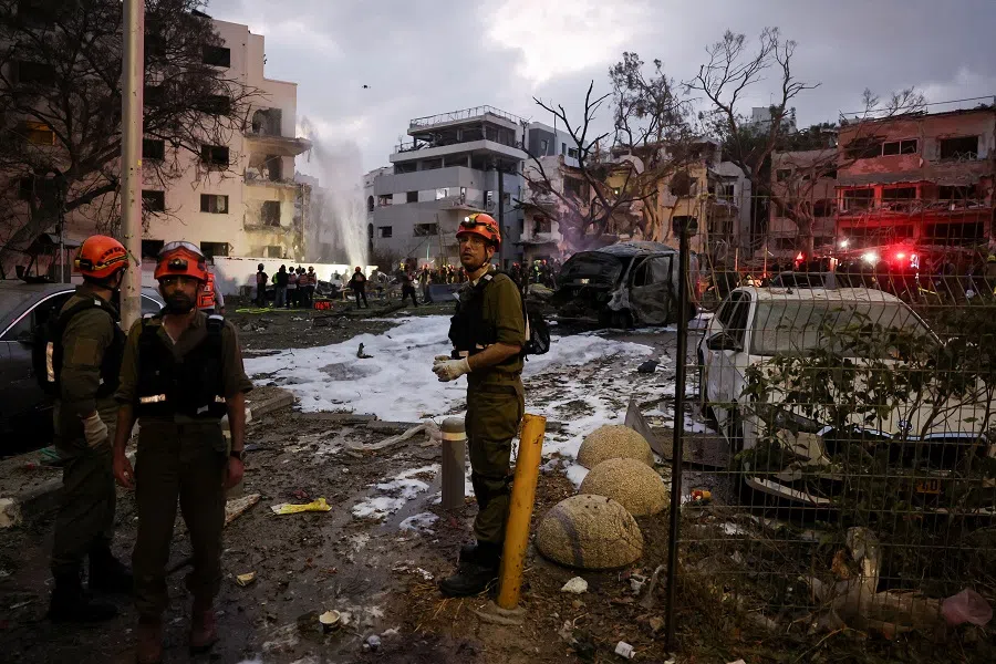 Emergency personel work at an impact site following a missile attack from Iran on Israel, in Tel Aviv, Israel, on 16 June 2025. (Ronen Zvulun/Reuters)
