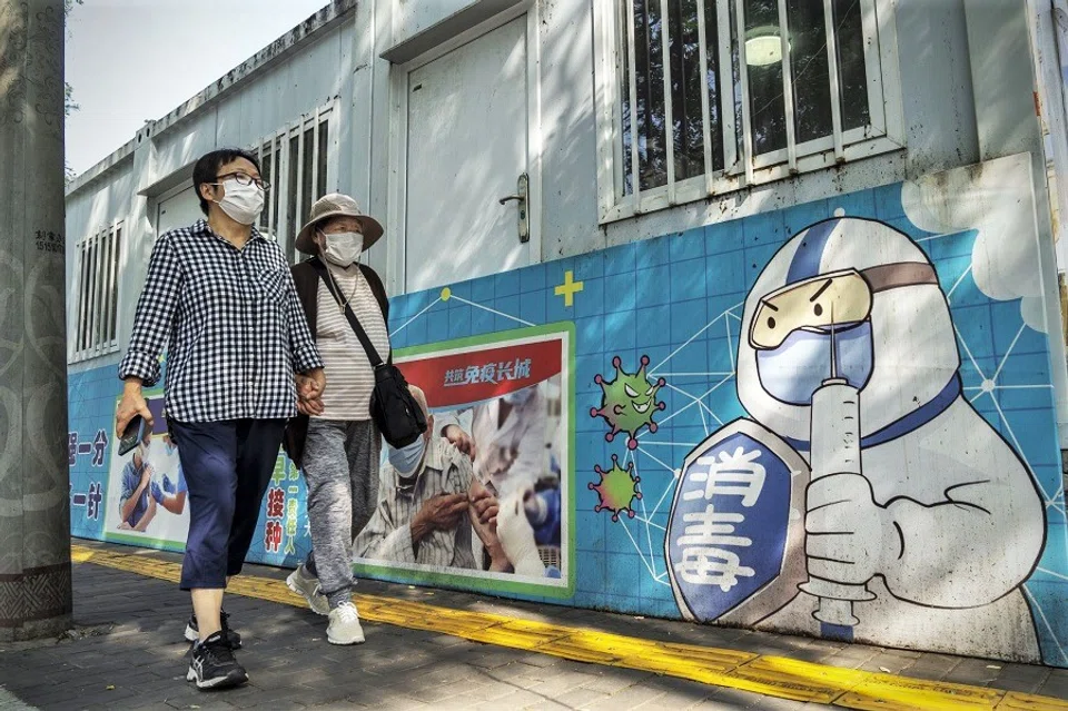 An advertisement promoting Covid-19 vaccination is seen in Beijing, China, on 30 August 2022. (Bloomberg)