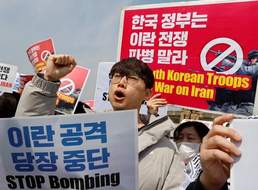 An activist shouts slogans during a rally against the US demand for South Korea to deploy troops to the Strait of Hormuz, outside the presidential Blue House in Seoul, South Korea, on 16 March 2026. (Kim Soo-hyeon/Reuters)