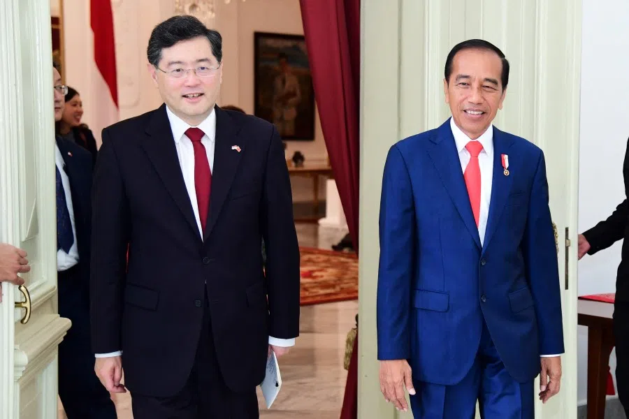 Indonesian President Joko Widodo walks with Chinese Foreign Minister Qin Gang during their meeting in the palace in Jakarta, Indonesia, 22 February 2023. (Indonesia's Presidential Palace/Handout via Reuters)