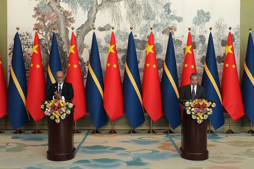 China's Foreign Minister Wang Yi and Nauru's Minister of Foreign Affairs and Trade Lionel Aingimea speak after signing a joint communiqué on the resumption of diplomatic relations between the People's Republic of China and the Republic of Nauru at the Diaoyutai State Guesthouse in Beijing on 24 January 2024. China and Nauru formally re-established diplomatic relations on 24 January, after the tiny South Pacific nation cut ties with Taiwan. (Andrea Verdelli/AFP)