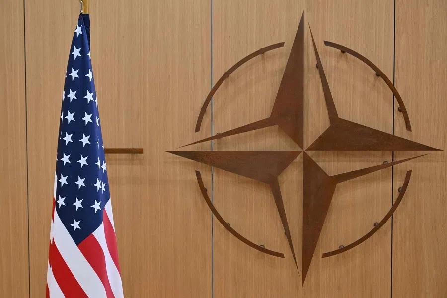 This photo shows the logo of the North Altantic Treaty Organisation (NATO) and the US flag prior to a meeting by the US special envoy for Ukraine and the NATO Secretary General, to address the ongoing war in Ukraine, at NATO headquarters in Brussels, on 17 February 2025. (Nicolas Tucat/AFP)
