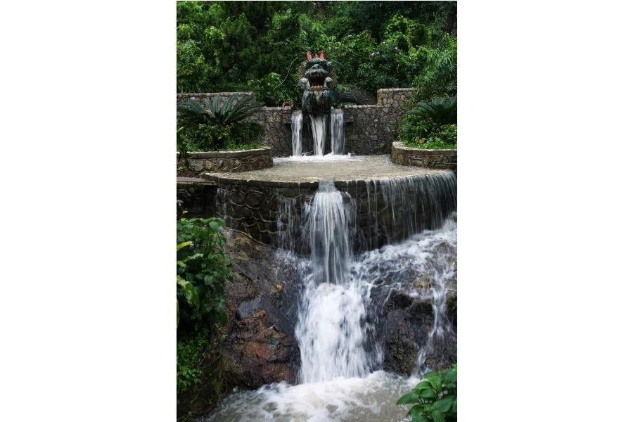 A dragon-shaped waterfall in Dragon Garden. (Getty Images)