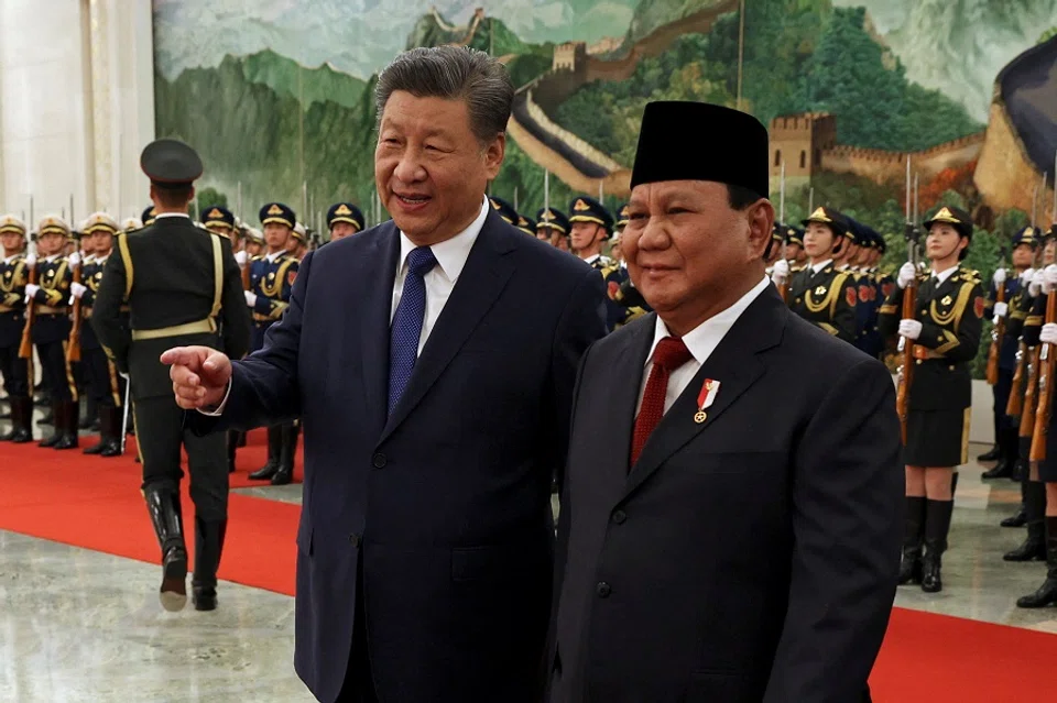 Chinese President Xi Jinping and Indonesian President Prabowo Subianto attend a welcome ceremony at the Great Hall of the People in Beijing, China, on 9 November 2024. (Florence Lo/Reuters)