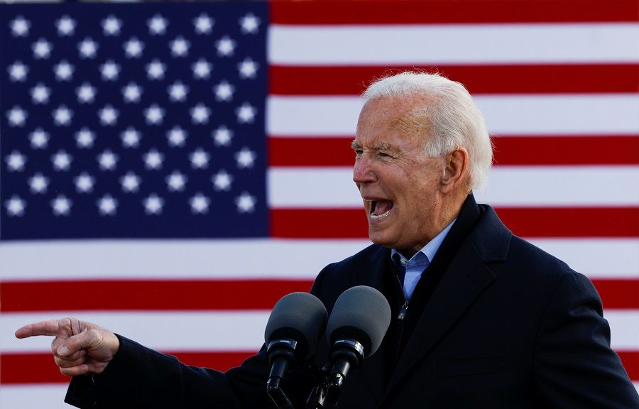 Democratic US presidential nominee and former Vice President Joe Biden gestures as he speaks during a drive-in campaign stop in Des Moines, Iowa, US, 30 October 2020. (Brian Snyder/Reuters)