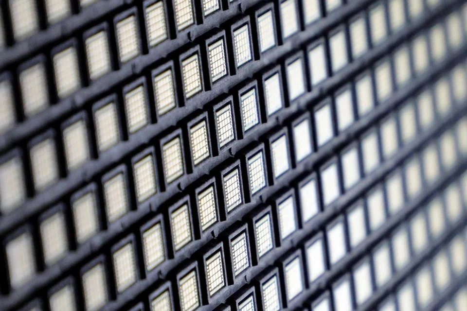 Semiconductors are pictured at the chip packaging firm Unisem Berhad plant in Ipoh, Malaysia, on 15 October 2021. (Lim Huey Teng/Reuters)