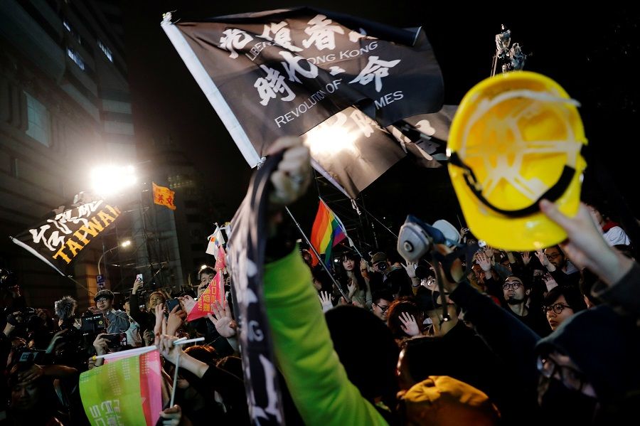 Hong Kong anti-government protesters attend a rally in support of Taiwan President Tsai Ing-wen outside the Democratic Progressive Party (DPP) headquarters in Taipei, Taiwan, 11 January 2020. (Tyrone Siu/File Photo/Reuters)