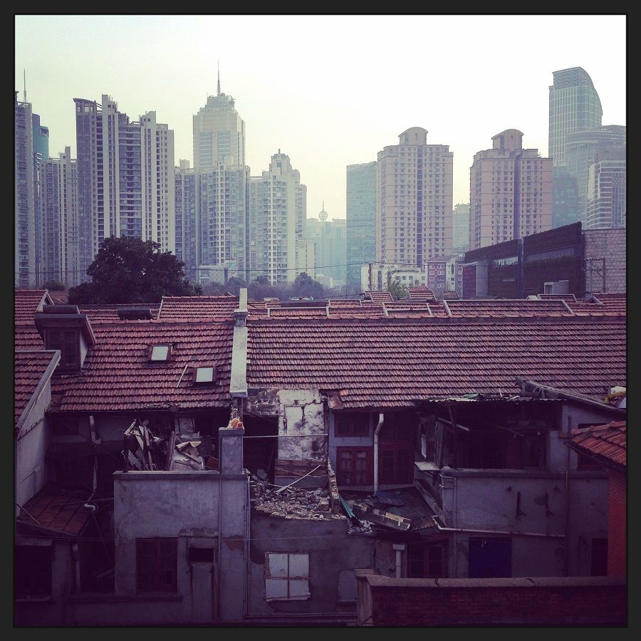 The contrast between the old dwellings in the Zhabei district with the modern blocks in the background.