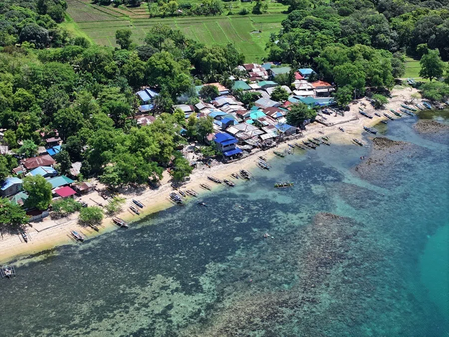 A drone view shows fishing vessels docked in San Salvador, Masinloc, Zambales province, Philippines, 8 July 2026.