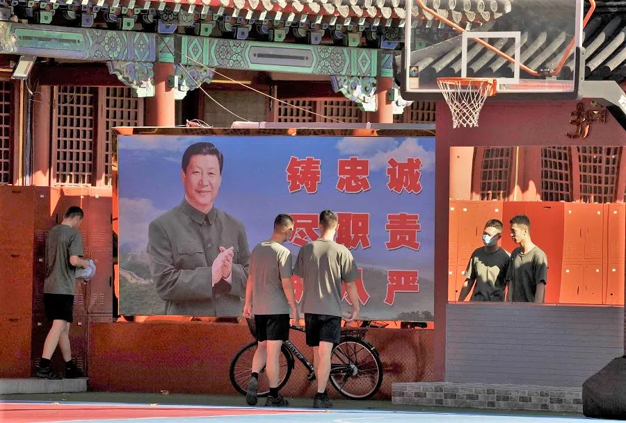 Chinese soldiers walk near the entrance of the Forbidden City in Beijing, China, on 20 September 2022. (Noel Celis/AFP)