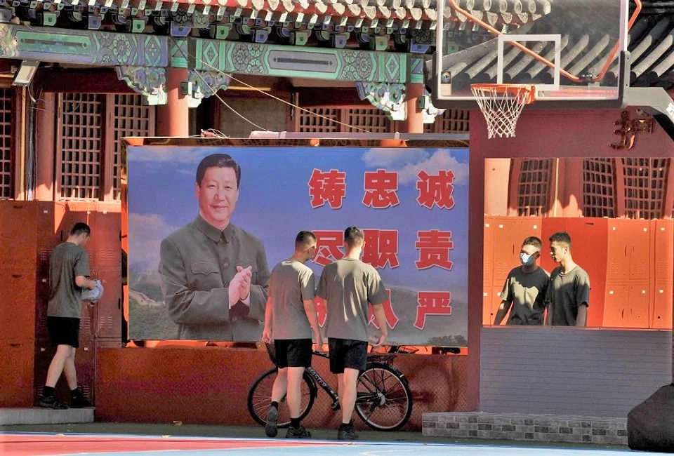 Chinese soldiers walk near the entrance of the Forbidden City in Beijing, China, on 20 September 2022. (Noel Celis/AFP)