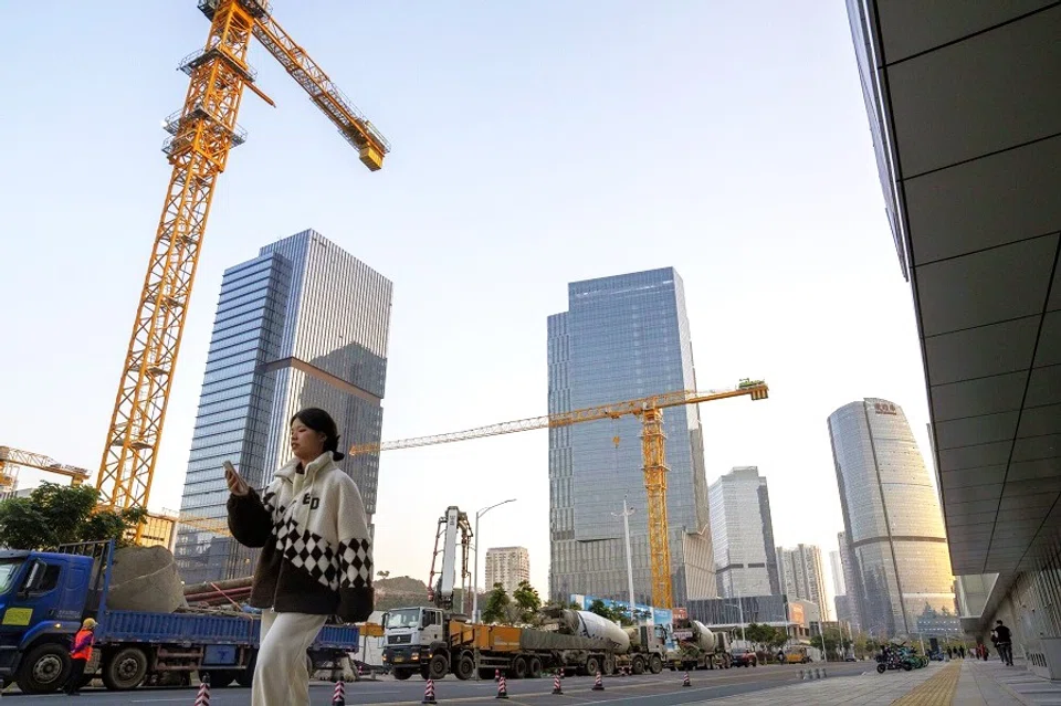 Pedestrians in Xiamen, China, on 5 January 2024. (Raul Ariano/Bloomberg)