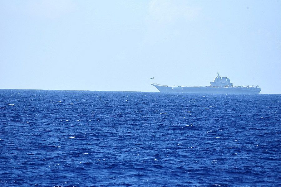A helicopter takes off from China's Shandong aircraft carrier, over Pacific Ocean waters, south of Okinawa prefecture, Japan, in this handout photo taken on 15 April 2023 and released by the Joint Staff Office of the Defense Ministry of Japan on 17 April 2023. (Joint Staff Office of the Defense Ministry of Japan/Handout via Reuters/File Photo)