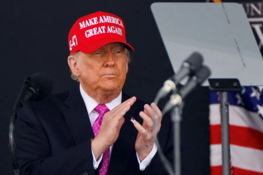US President Donald Trump wears a “Make America Great Again” (MAGA) hat as he attends the commencement ceremony at West Point Military Academy in West Point, New York, US, on 24 May 2025. (Eduardo Munoz/Reuters)