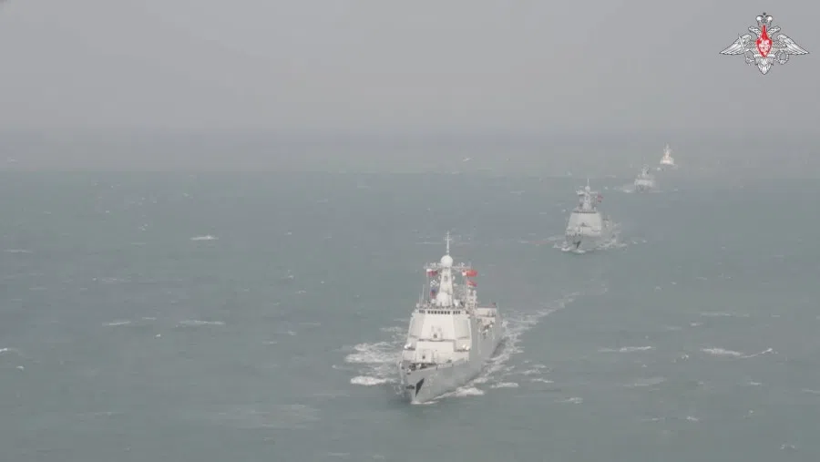 Ships sail in formation during the Russia-China naval exercise "Maritime Interaction-2022" in the East China Sea, in this still image taken from video released 28 December 2022. (Russian Defence Ministry/Handout via Reuters)