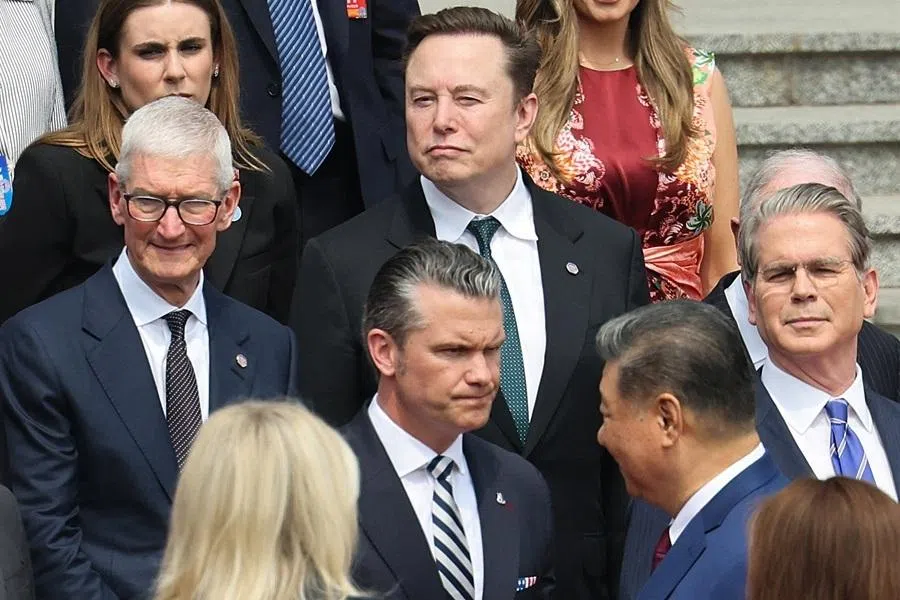 Apple CEO Tim Cook, Tesla CEO Elon Musk, US Secretary of War Pete Hegseth and US Treasury Secretary Scott Bessent attend the welcome ceremony for US President Donald Trump by Chinese President Xi Jinping, at the Great Hall of the People in Beijing, China, on 14 May 2026. (Maxim Shemetov/Pool/Reuters)