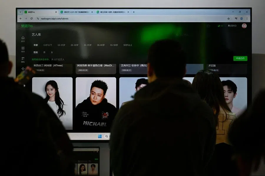 A TV screen shows iQiYI's artists database on Nadou pro, iQIYIs AI product for professional film and television production, during the iQIYI World Conference in Beijing on 20 April 2026. (Wang Zhao/AFP)