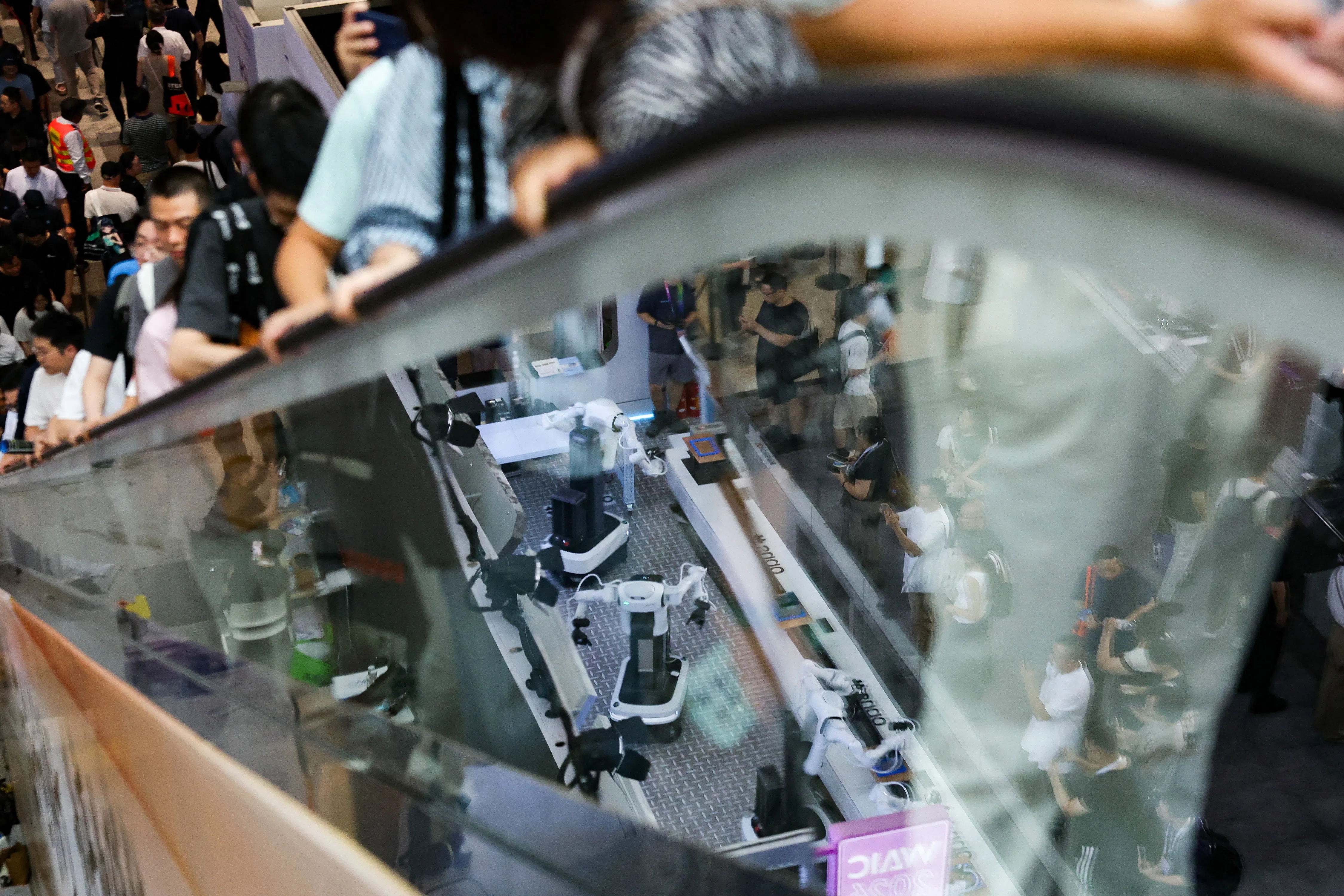 People visit the World Artificial Intelligence Conference (WAIC) in Shanghai, China, on 18 July 2026.