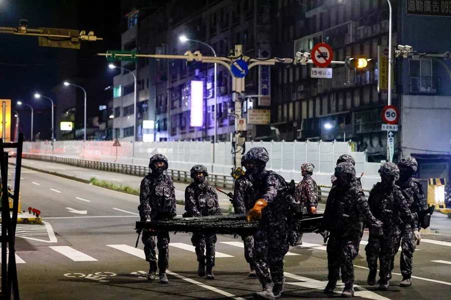 Taiwanese Military Police personnel install road blockades during a drill as part of the annual Han Kuang military exercises in Taipei, Taiwan, on 12 August 2026.