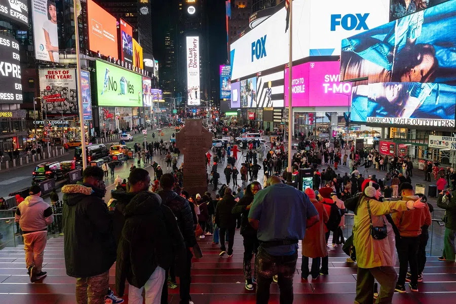 People walk through Times Square on 6 February 2024 in New York City, US. (Spencer Platt/Getty Images/AFP)
