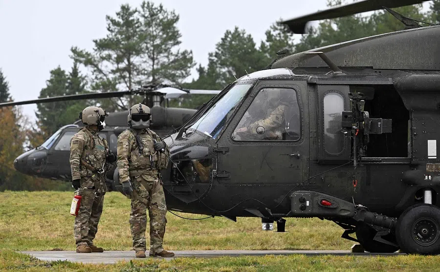 US soldiers stand next to a Blackhawk helicopter, on 24 October 2023. (Christof Stache/AFP)