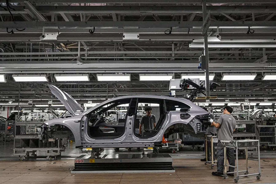 Employees work on an electric vehicle production line at a factory of Chinese automaker NIO in Hefei, in eastern China's Anhui province on 24 September 2025. (Jade Gao/AFP)