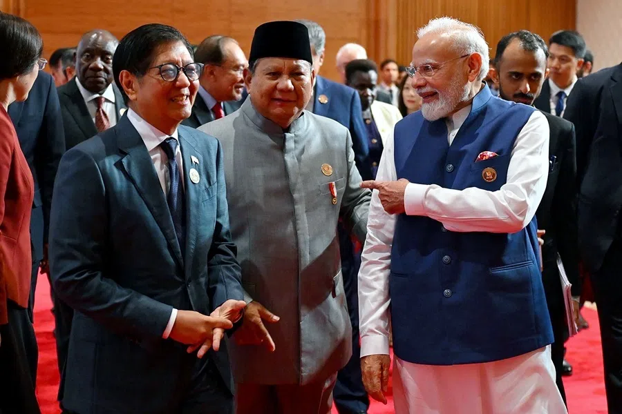 This handout photograph taken on 13 September 2026 and released by the Indian Press Information Bureau (PIB) shows India's Prime Minister Narendra Modi (right) speaking with Indonesia's President Prabowo Subianto (centre) and Philippines' President Ferdinand Marcos during the 18th BRICS Summit in New Delhi.