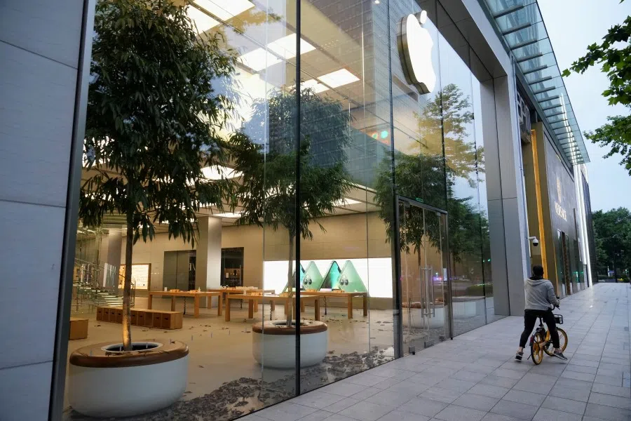 Fallen leaves are seen on the floor inside a closed Apple store, amid the Covid-19 outbreak in Shanghai, China, 19 May 2022. (Aly Song/Reuters)