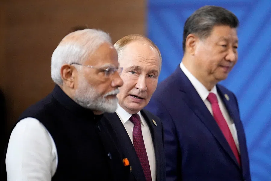 Indian Prime Minister Narendra Modi, Russian President Vladimir Putin and Chinese President Xi Jinping attend a family photo ceremony prior to the BRICS Summit plenary session in Kazan, Russia, 23 October 2024. (Alexander Zemlianichenko/Pool via Reuters)