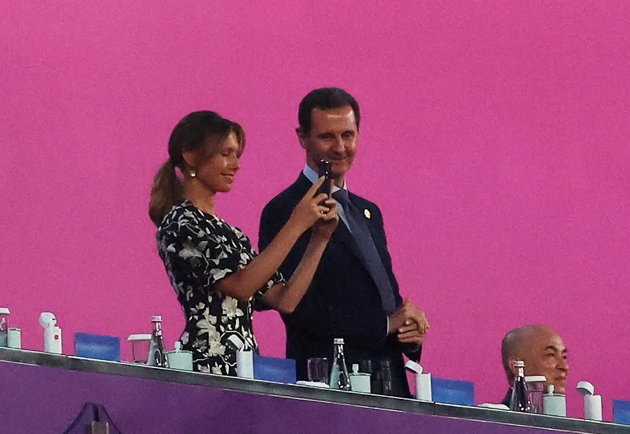 A shot of Bashar al-Assad and his wife Asma al-Assad at the opening ceremony of the Hangzhou 2022 Asian Games on 23 September 2023. (Tingshu Wang/Reuters)